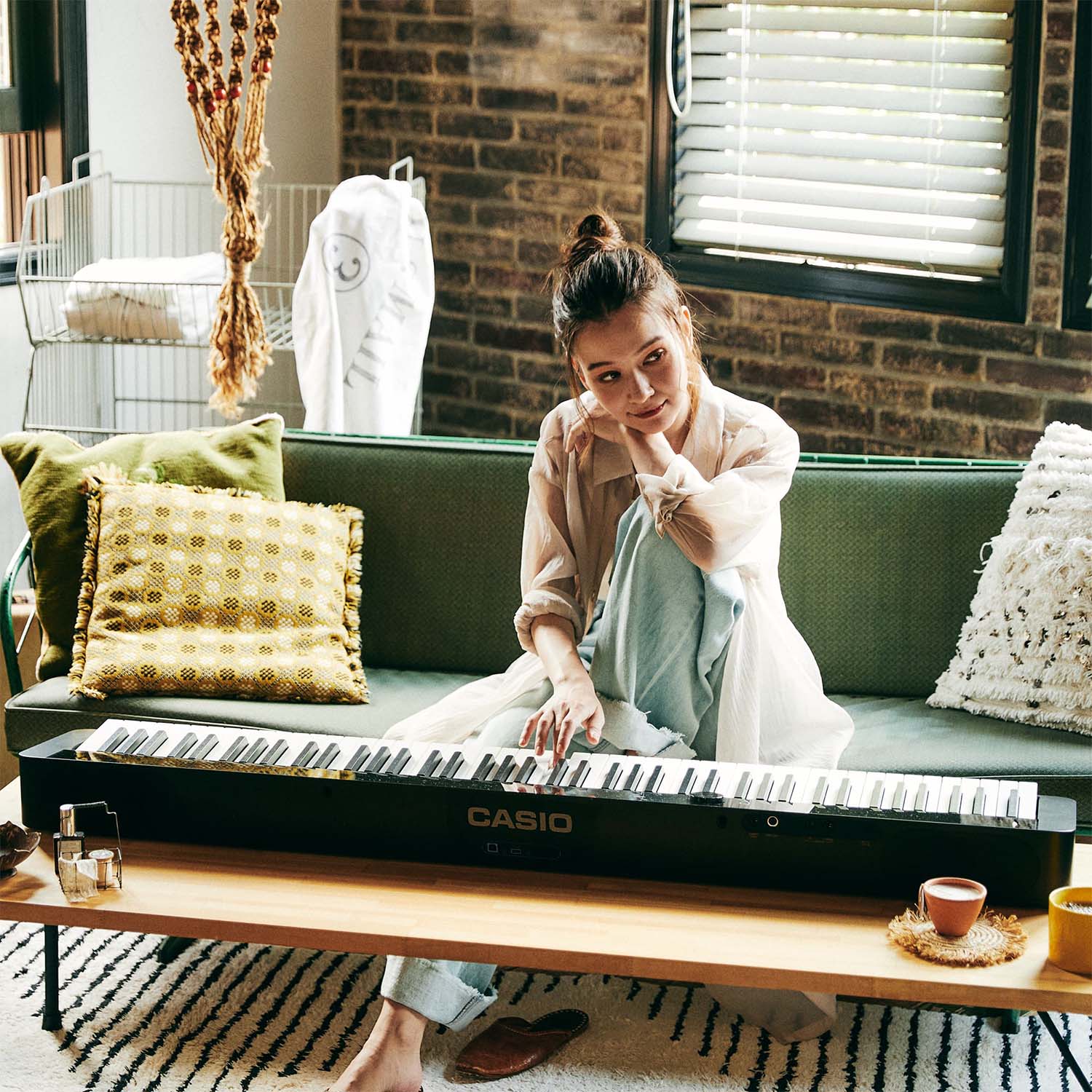 Image of Girl playing Casio PXS5000 in living room.