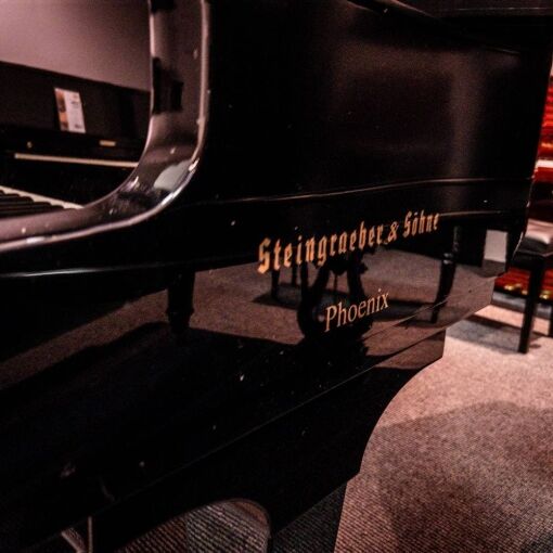 Used Steingraber Opus 168 Grand Piano in Polished Ebony side logo