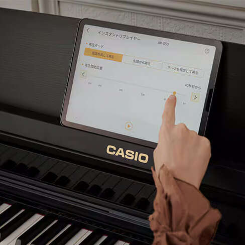 Someone using the Casio Music Space App with the AP-550